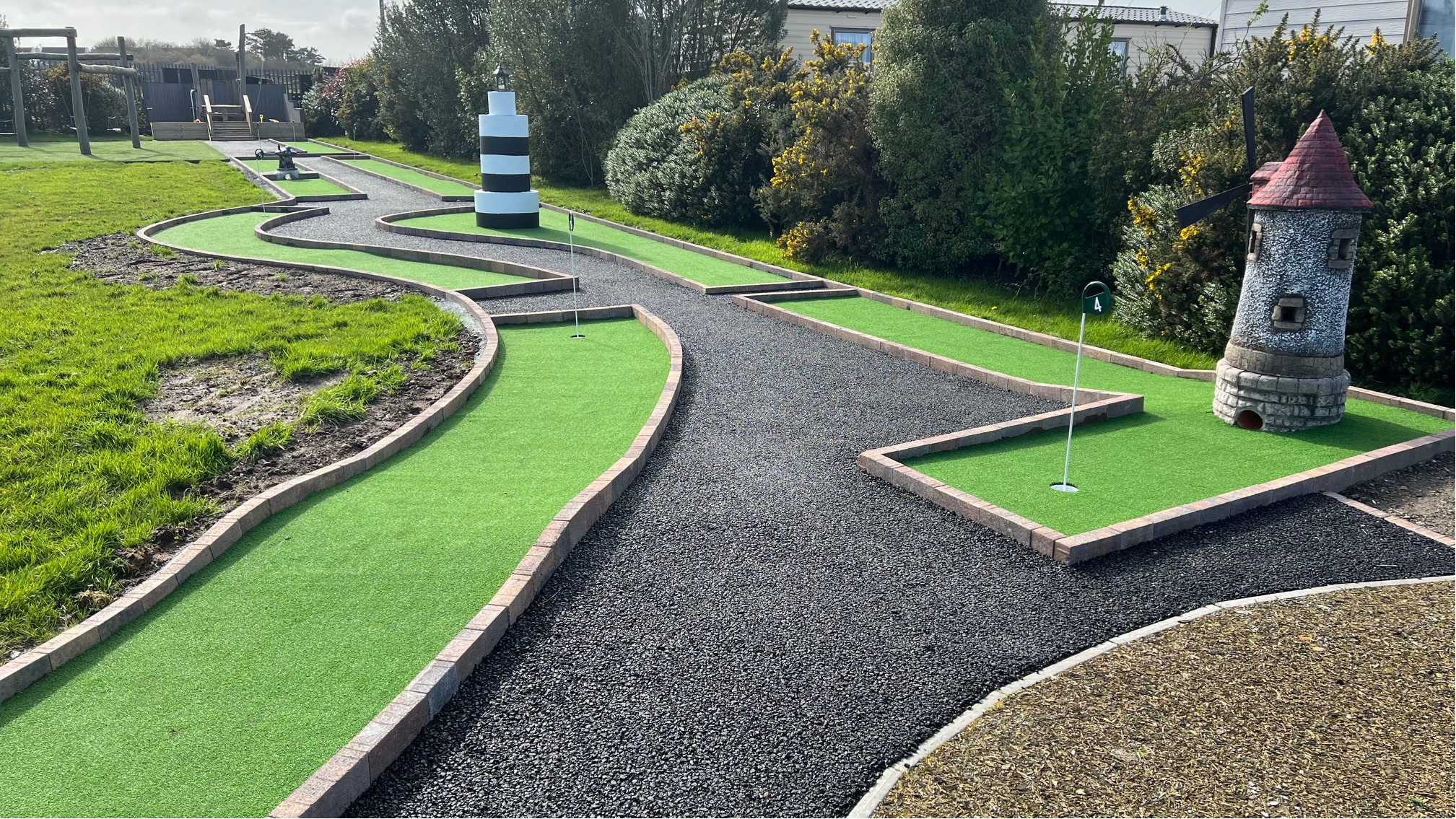Crazy golf course at Central Holiday Park Rosslare with lighthouse and windmill obstacles