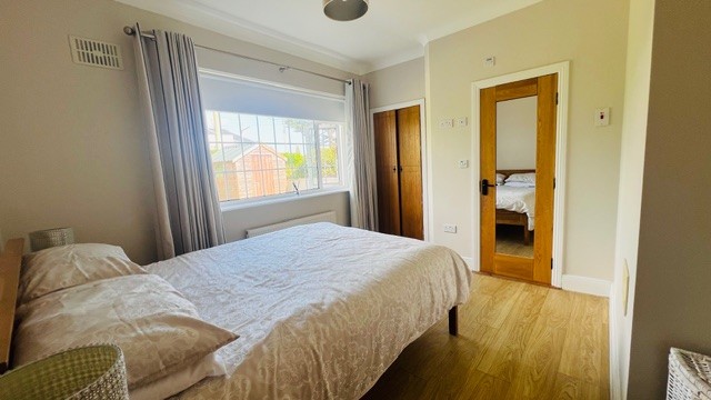 Double bedroom and wardrobe at Dash Bungalow